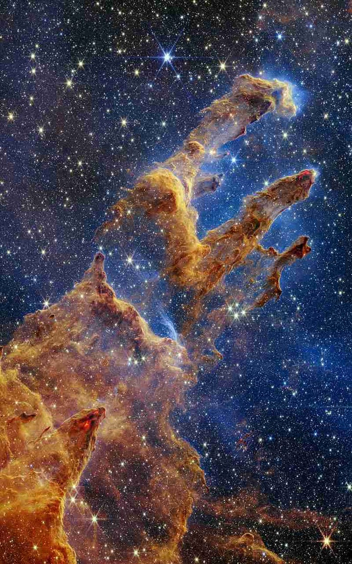 Four telescopic images of galaxies that look almost like body parts or beings. 