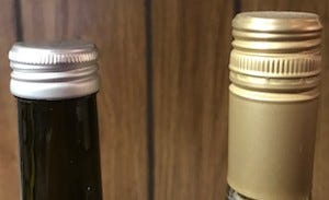 Standard Stelvin screw cap on the right. Short screw cap on the left.
