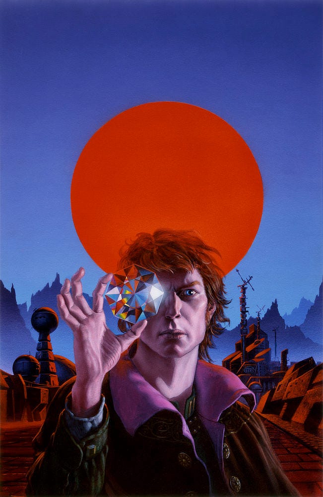 A man holds up an enormous cut crystal scattering color and the glare of light across its many facets. Held delicately between thumb and index finger, the gem is positioned over one eye. His face is dramatic in its angles with shadows providing dimension. His one eye revealed shows brilliant blue, a cool contrast to his wild red hair and long sideburns. Behind him mountains stand in silhouette with an enormous circle of red burning in the sky. In the more immediate background, buildings with an alien quality to their geometry line a brick street.