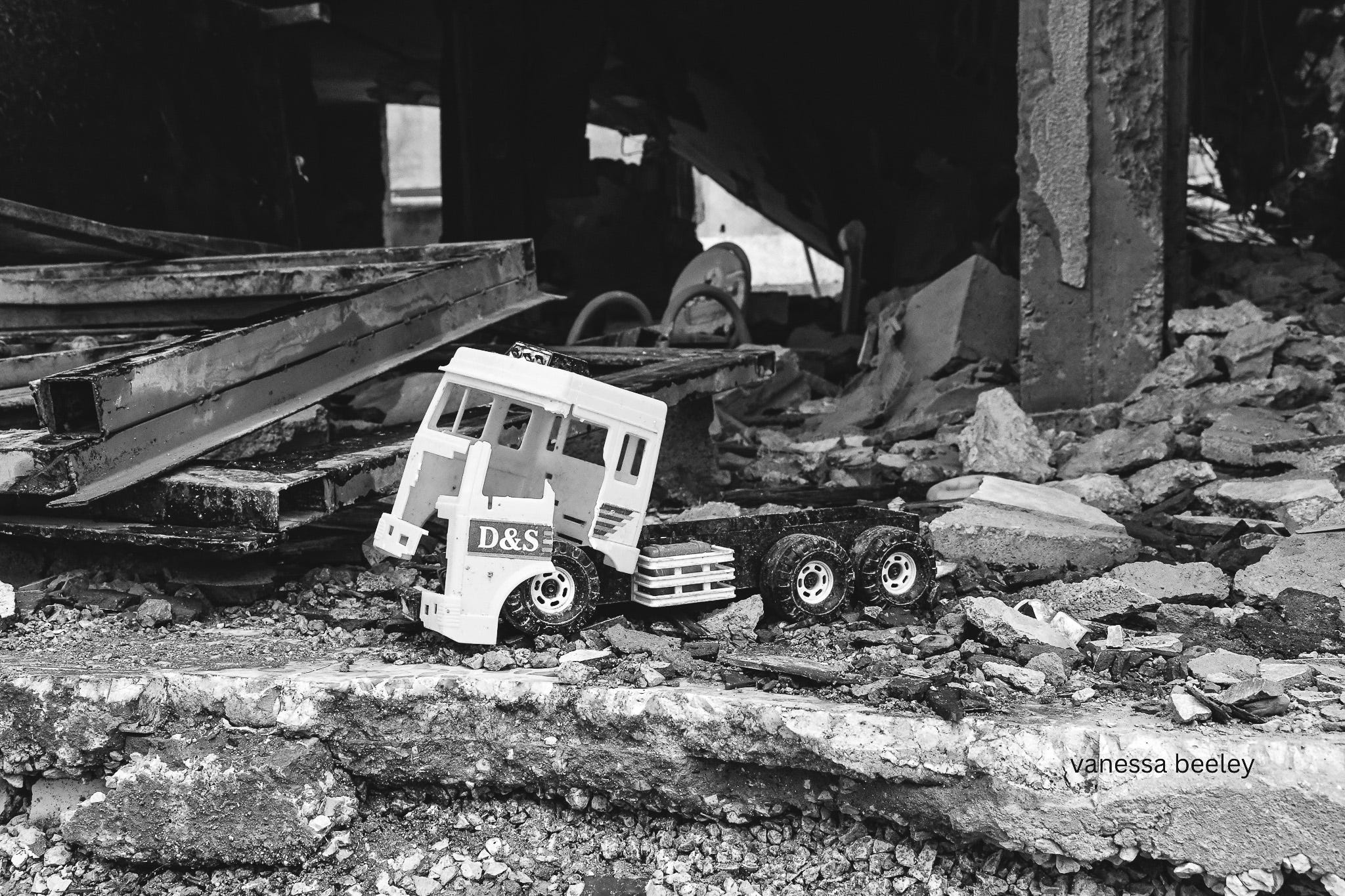 A child's toy stuck in the rubble of a home in Baalbek. Photo: Vanessa Beeley.