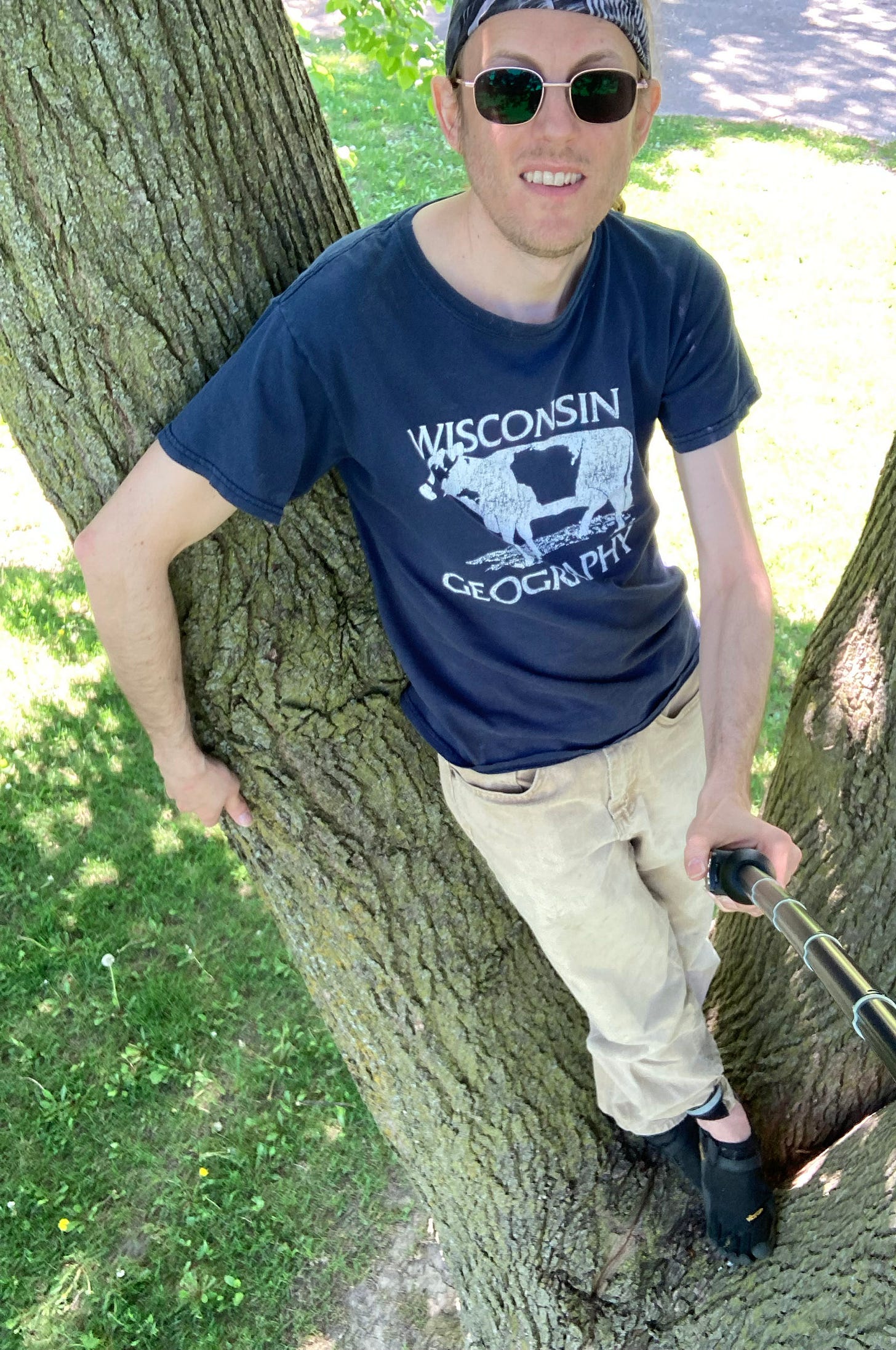 The author, triumphantly standing atop the tree trunk, five feet up The author, triumphantly standing atop the tree trunk, five feet up