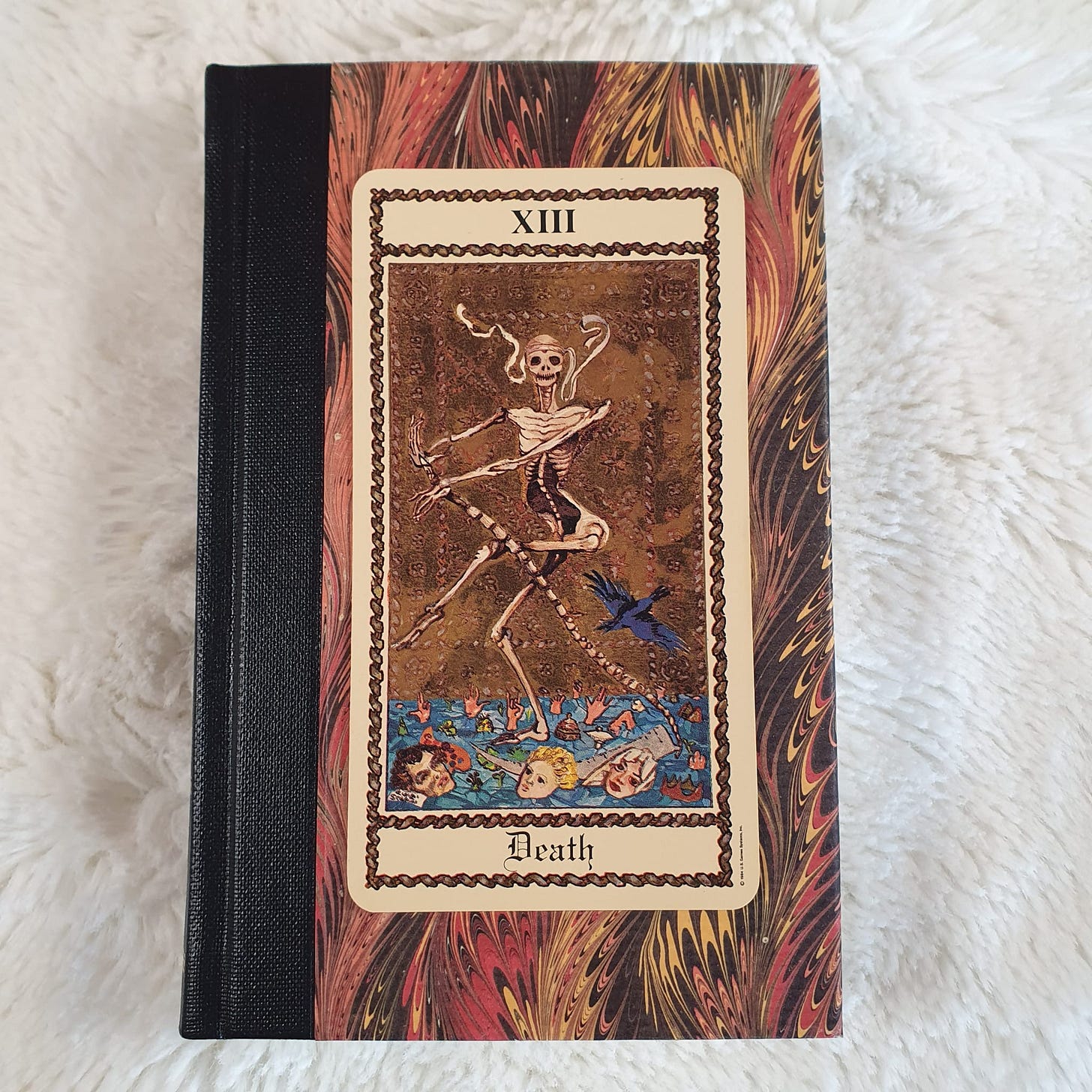XIII Death card from the Scapini Tarot, showing a dancing skeleton above figures submerged in water XIII Death card from the Scapini Tarot, showing a dancing skeleton above figures submerged in water