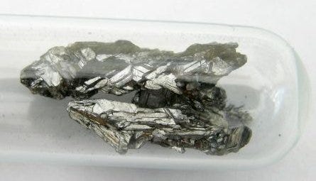 A metallic lump of elemental arsenic.
