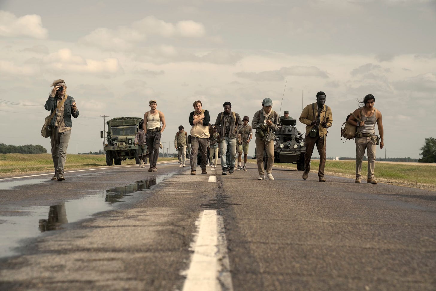Charlie Plummer as Barkovitch, Garrett Wareing as Stebbins, Cooper Hoffman as Garraty, David Jonsson as McVries, Ben Wang as Olson, Tut Nyuot as Baker, and Joshua Odjick as Parker in The Long Walk