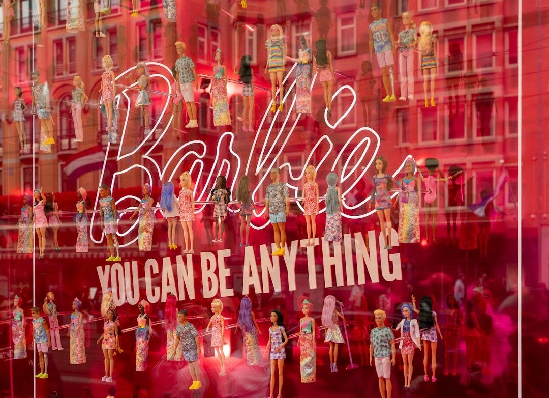 a window display of barbie dolls in a store a window display of barbie dolls in a store