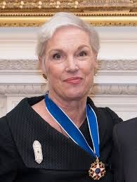A person with a blue medal

Description automatically generated