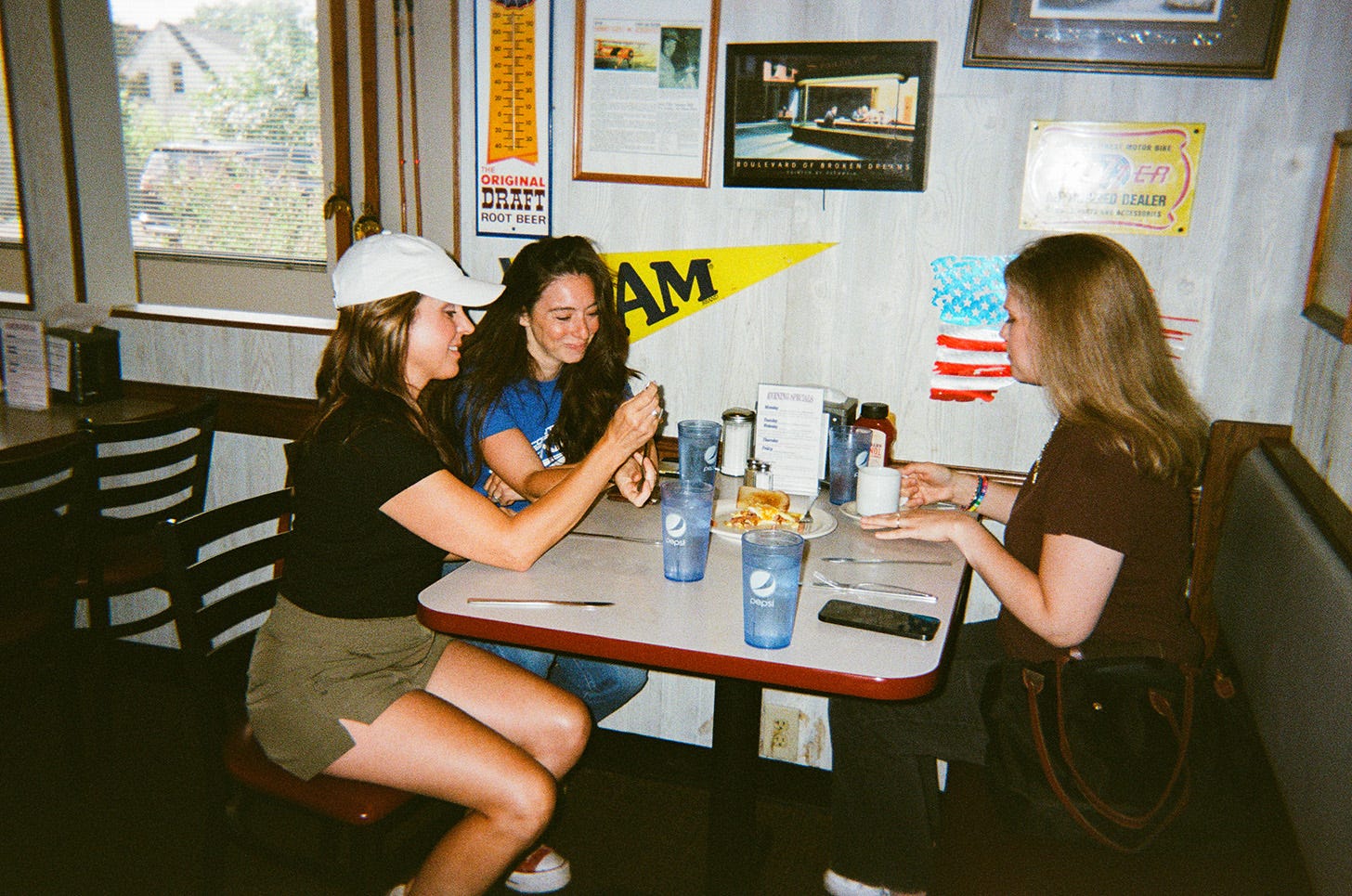 three women sharing a SPAM omelet in a diner