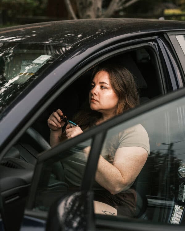 Katie Gallagher sitting in her car.