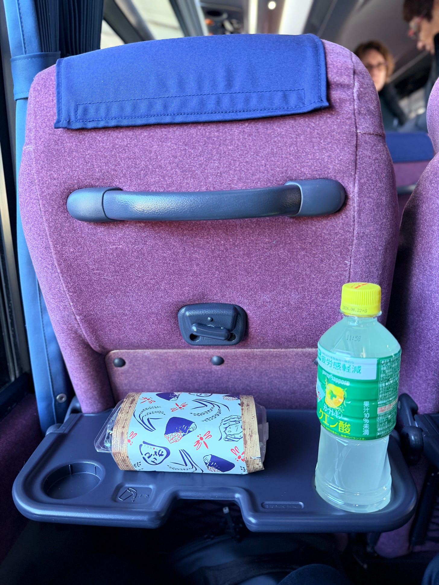 Inside the Nagano Snow Shuttle, behind the chair. Inside the Nagano Snow Shuttle, behind the chair.