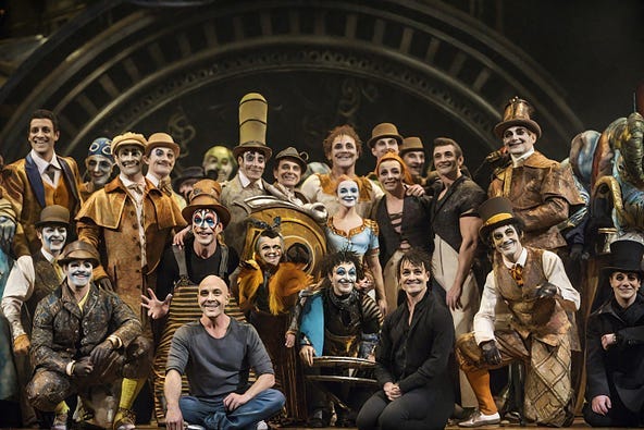 The whole team from Cirque Du Soleil Kurious depicted by the author in Leonardo AI Elements, based on the real photograph. Everyone is laughing and seems happy to have performed a wonderful show.