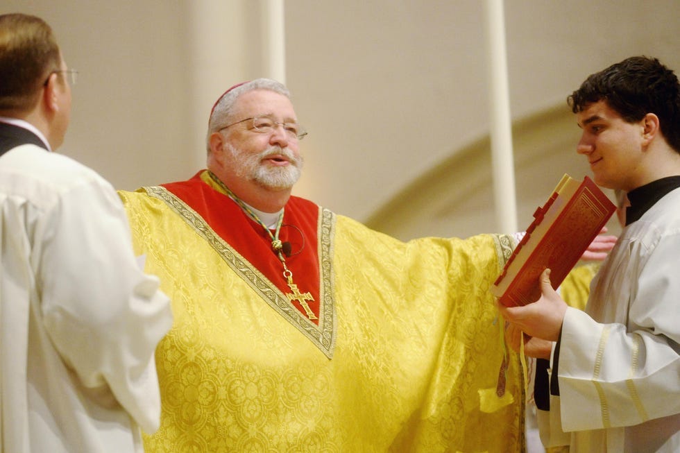 Bishop Daniel Jenky leads services on Easter Sunday in 2013 at St. Mary's Cathedral. [NICK SCHNELLE/JOURNAL STAR FILE PHOTO]