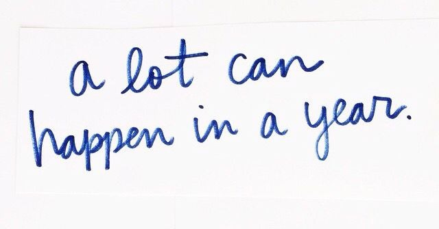This may contain: a sign that says a lot can happen in a year with blue writing on it