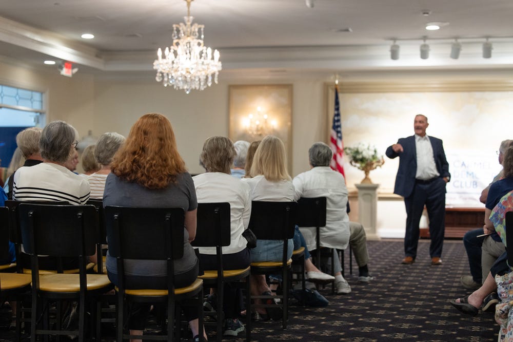 Terry Goodin speaking to crowd in Carmel