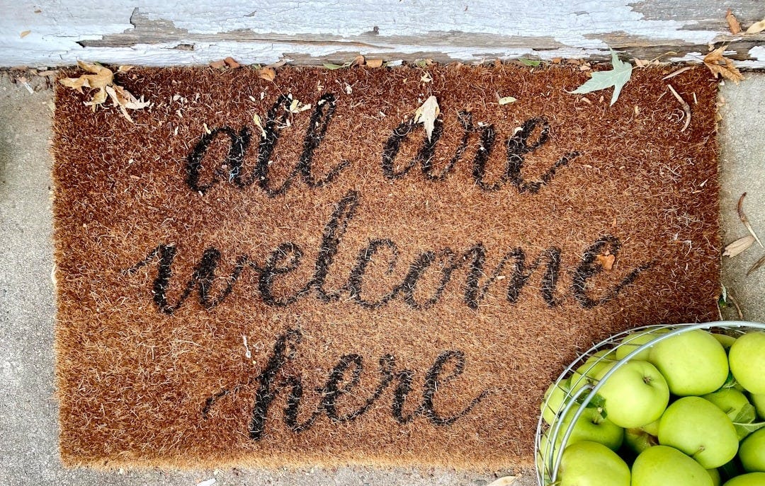 brown and black welcome rug