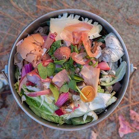A grid of nine tin buckets of compost.