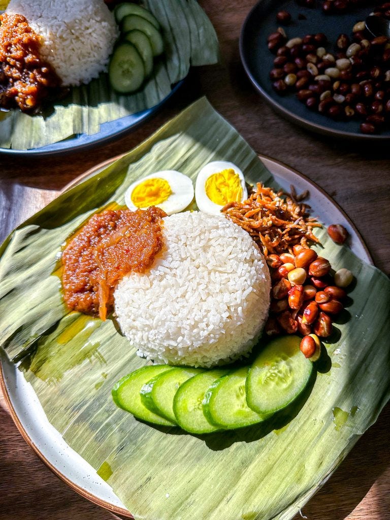 easy malaysian national dish nasi lemak fragrant coconut rice with sambal crispy fried anchovies roasted peanuts eggs cucumbers easy malaysian national dish nasi lemak fragrant coconut rice with sambal crispy fried anchovies roasted peanuts eggs cucumbers
