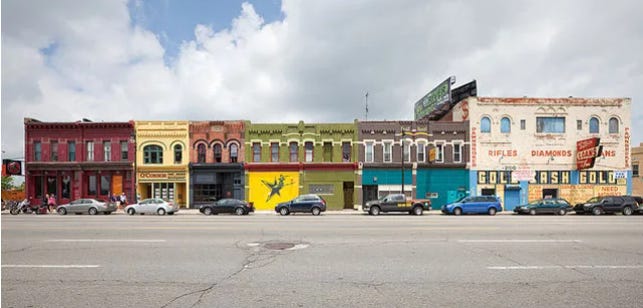 A row of colorful two-story storefront buildings in Corktown, Detroit.