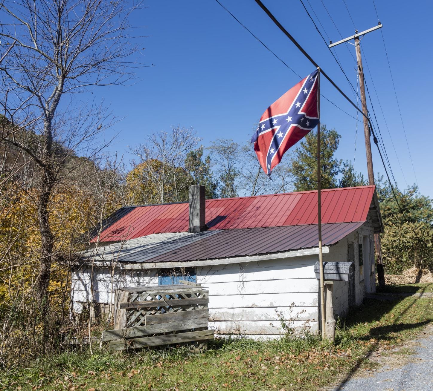 The battle flag of the secessionist Confederate States of America during  the U.S. Civil War, flying near cabins in the unincorporated town of Gap  Mills in southeastern West Virginia | Library of
