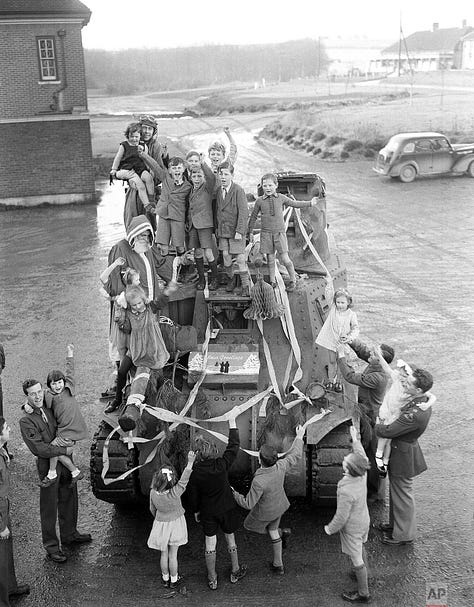 Black and white images of Christmas parties for children during the Second World War