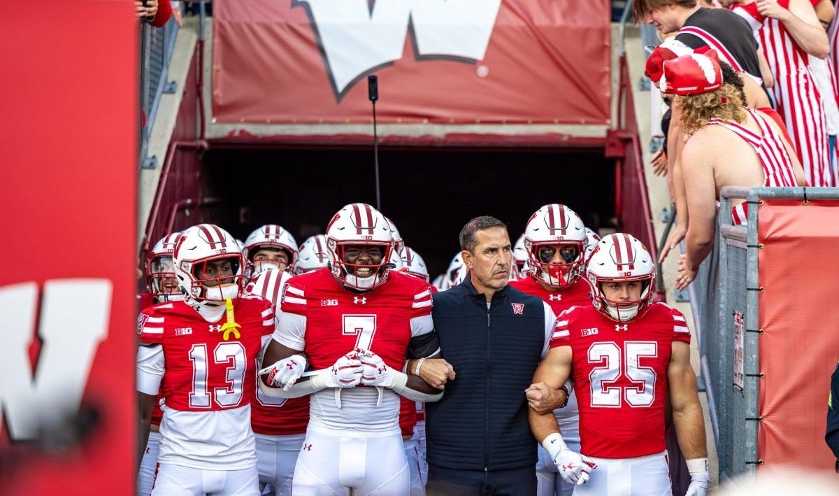 Wisconsin Badgers head football coach Luke Fickell leads players out of the tunnel onto the field at Camp Randall Stadium before a game. Wisconsin Badgers head football coach Luke Fickell leads players out of the tunnel onto the field at Camp Randall Stadium before a game.