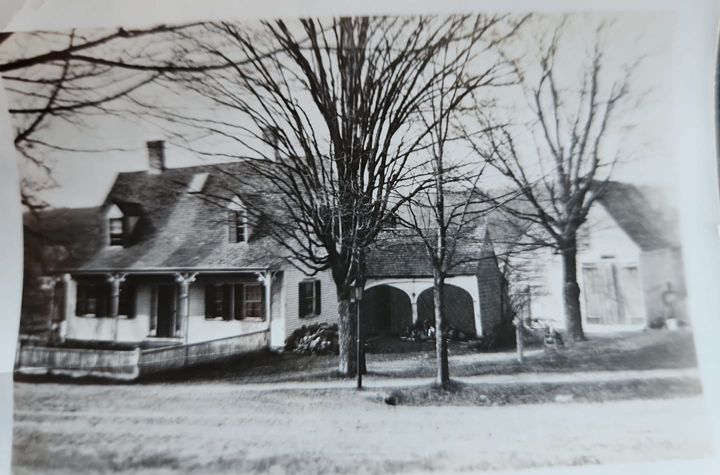 house with porch and dormers