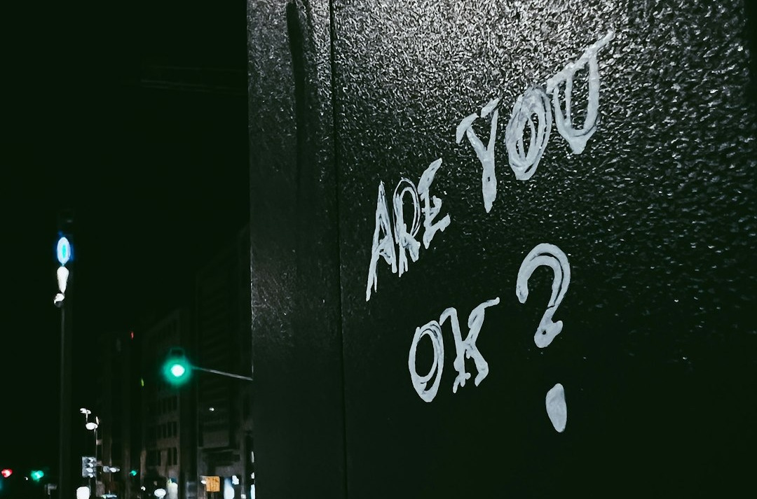 graffiti on the side of a building that says are you ok? graffiti on the side of a building that says are you ok?
