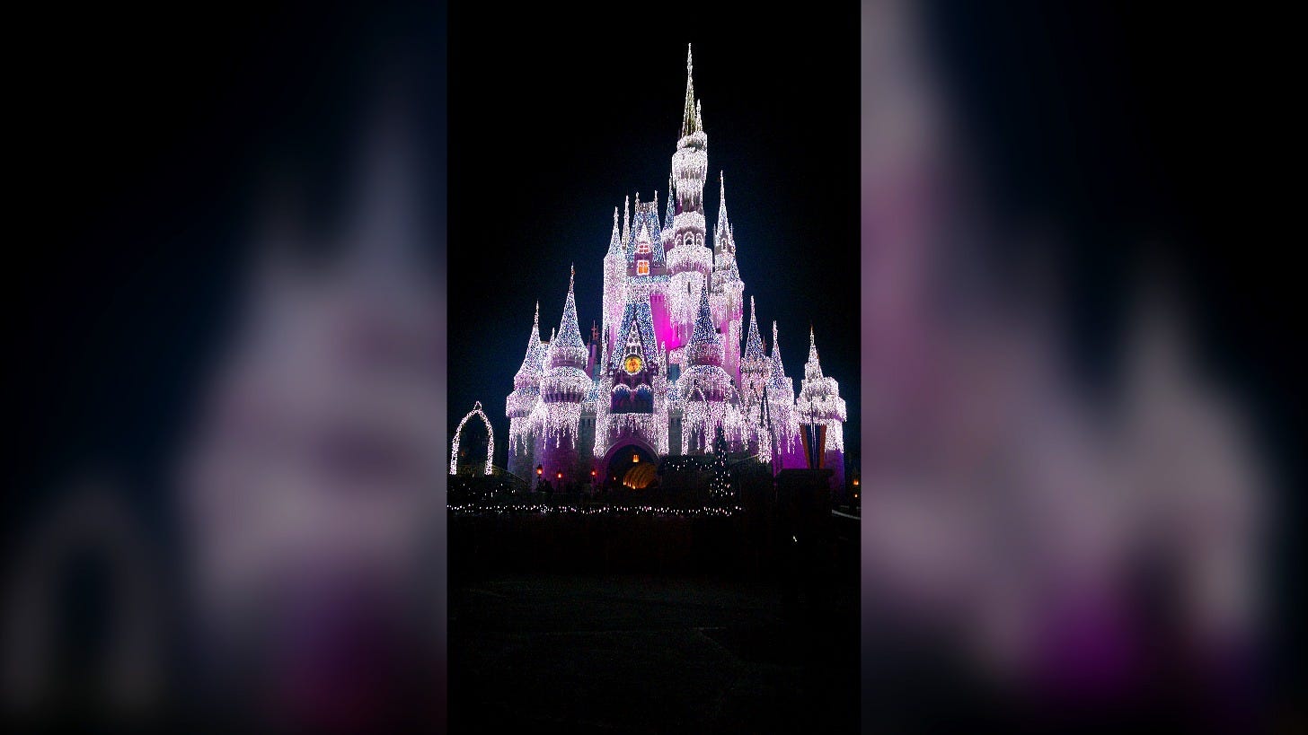 Cinderella Castle lit for the holidays at Magic Kingdom. Image: elisfkc via Wikimedia Commons