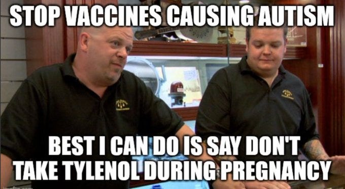 Two men in black polo shirts with a gold logo, standing in a pawn shop setting with glass cases and shelves. Text overlay reads "STOP VACCINES CAUSING AUTISM" and "BEST I CAN DO IS SAY DON\'T TAKE TYLENOL DURING PREGNANCY". Two men in black polo shirts with a gold logo, standing in a pawn shop setting with glass cases and shelves. Text overlay reads "STOP VACCINES CAUSING AUTISM" and "BEST I CAN DO IS SAY DON\'T TAKE TYLENOL DURING PREGNANCY".