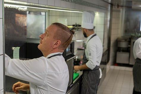 Inside the kitchen, including dishwasher