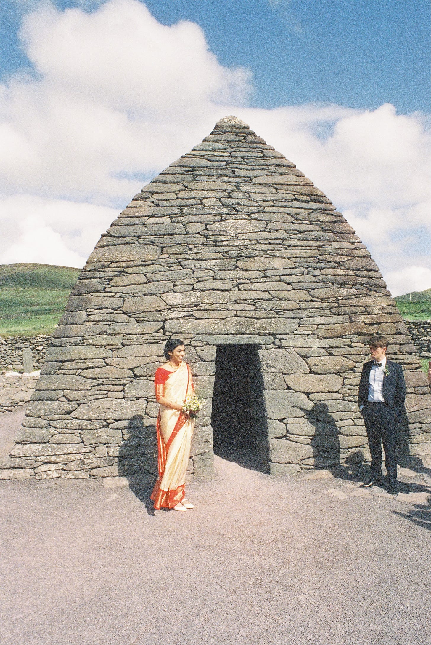 Bride and groom outside Gallarus Oratory