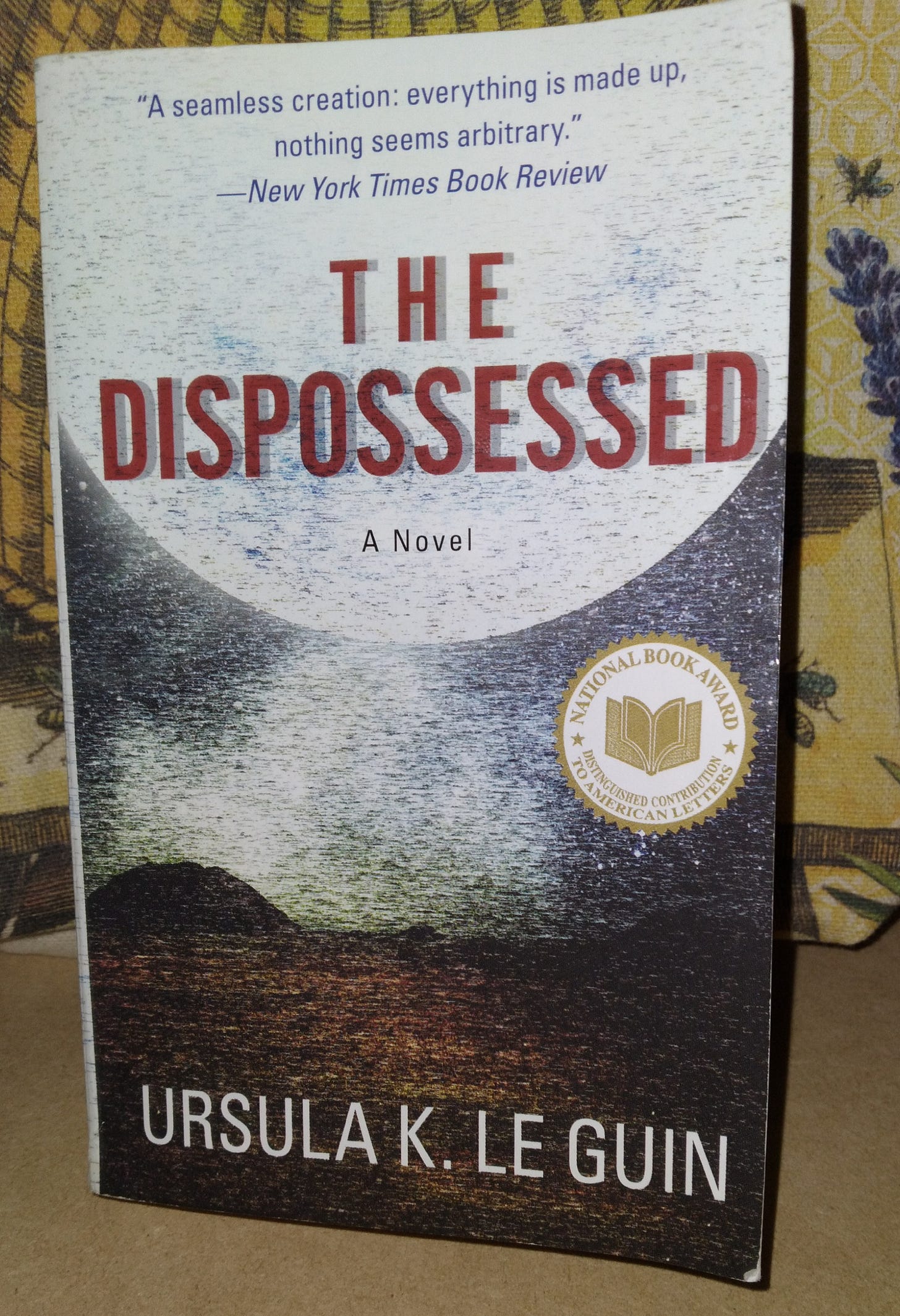 mass market paperback copy of Ursula K. Le Guin's novel "The Dispossessed"