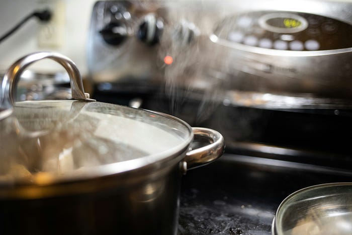 A steaming pot on a stovetop. Pasteurizing food is as simple as raising it to a high enough temperature to kill off germs.