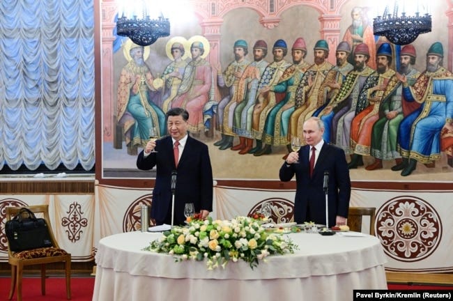 Xi Jinping and Vladimir Putin share a toast on March 21 during the Chinese leader's three-day visit to Moscow. Xi Jinping and Vladimir Putin share a toast on March 21 during the Chinese leader's three-day visit to Moscow.