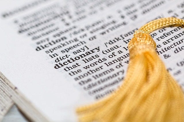 Close-up of an entry in an English dictionary. Close-up of an entry in an English dictionary.