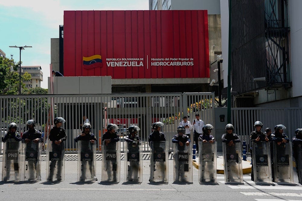 Bolivarian National Police stand outside Petroleos of Venezuela PDVSA headquarters during a protest in Caracas, Venezuela, Thursday, Oct. 1, 2026 (AP)