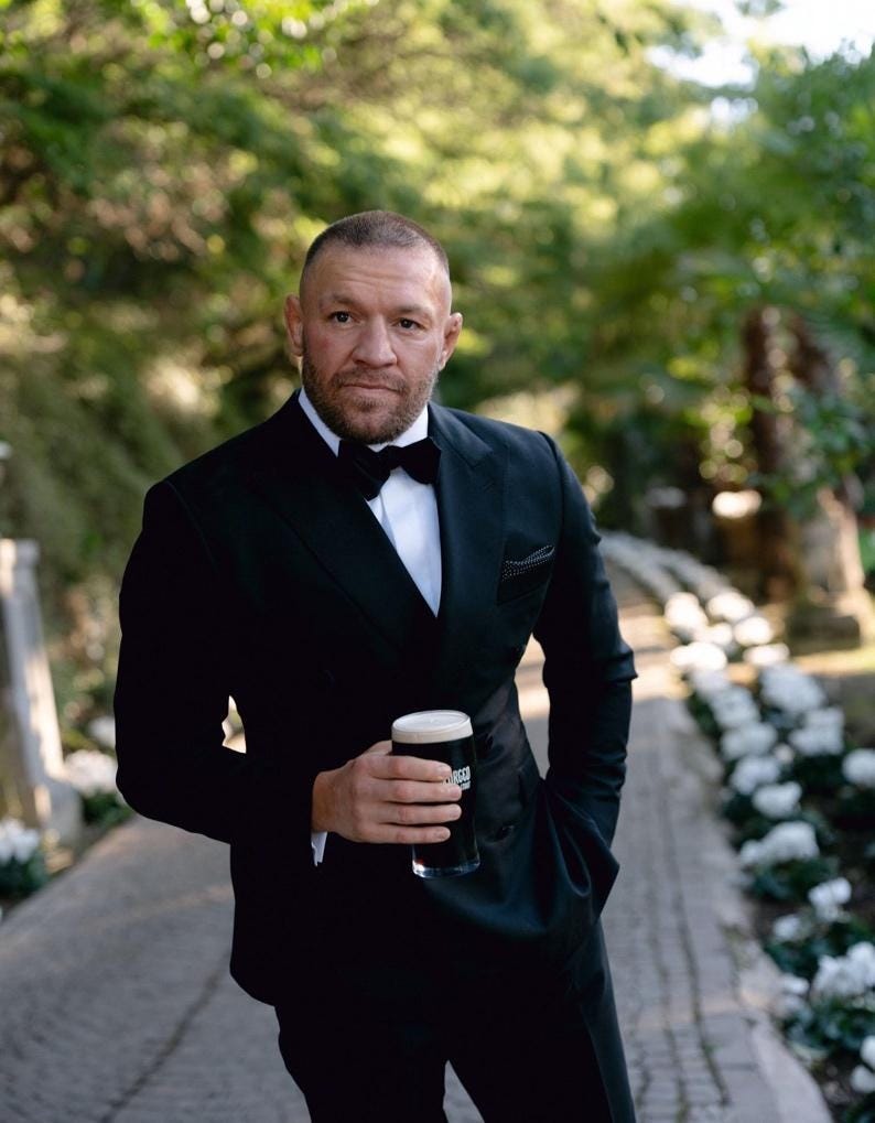 A person in a tuxedo holding a beer

AI-generated content may be incorrect.