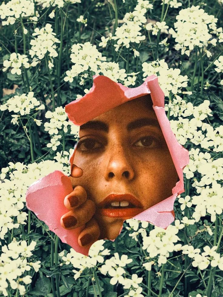 A face wearing red lipstick peers through a paper hole that’s been ripped open. The paper itself is full of white flowers.