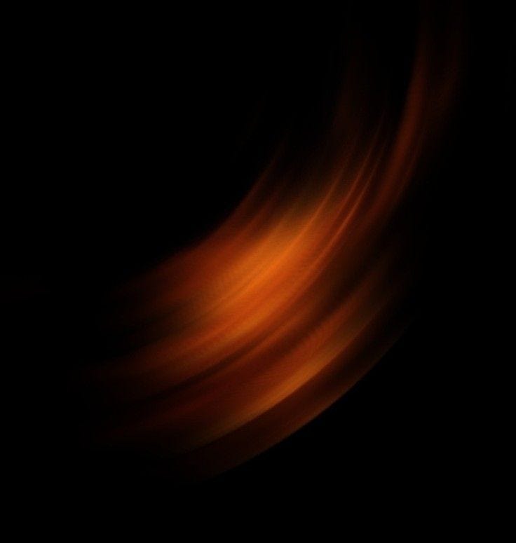 This may contain: an orange and black background with some blurry lines in the middle on top of it This may contain: an orange and black background with some blurry lines in the middle on top of it