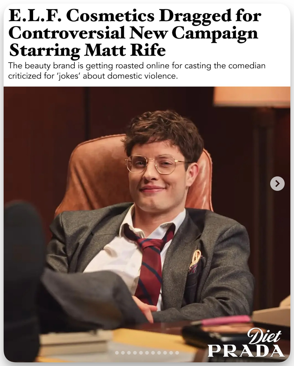 Headline reads: “E.L.F. Cosmetics Dragged for Controversial New Campaign Starring Matt Rife. The beauty brand is getting roasted online for casting the comedian criticized for ‘jokes’ about domestic violence.” Below the headline is an image of comedian Matt Rife, sitting back in an office chair with a smirk, wearing glasses, a suit jacket, and a loosened tie. The bottom corner has the Diet Prada logo.