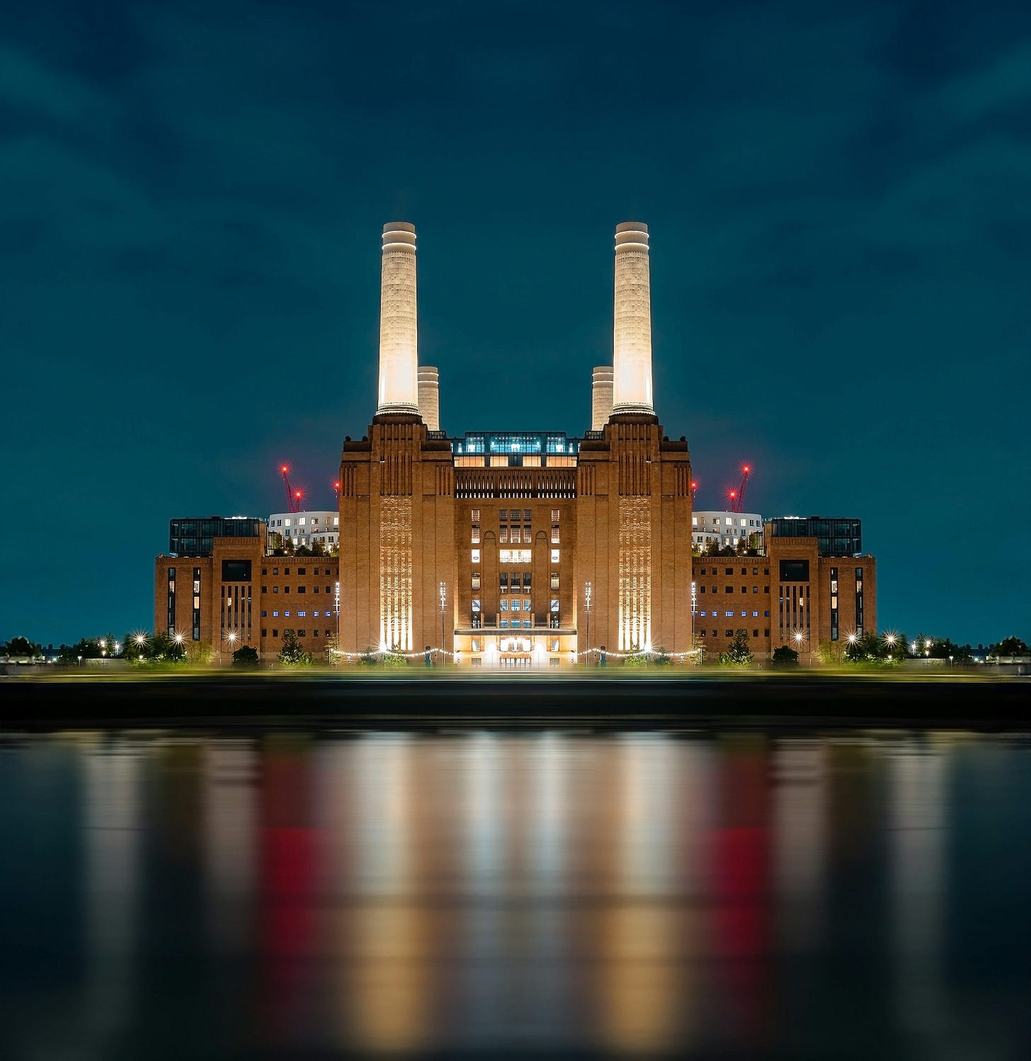 a large building with two towers lit up at night