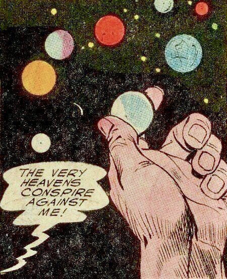This may contain: an old comic book page with a hand holding a small object in it's left hand