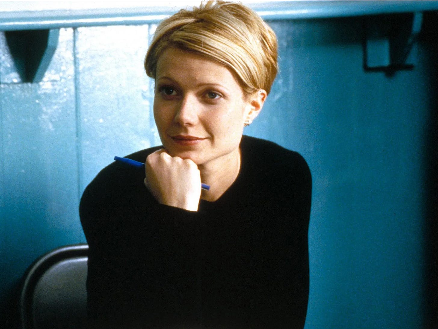 Gwyneth Paltrow in a still from Sliding Doors, with an insane blonde pixie cut