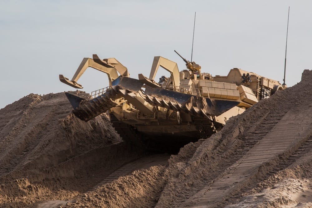 Assault Breacher Vehicle tackles berm