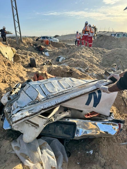 A crushed vehicle at the scene.