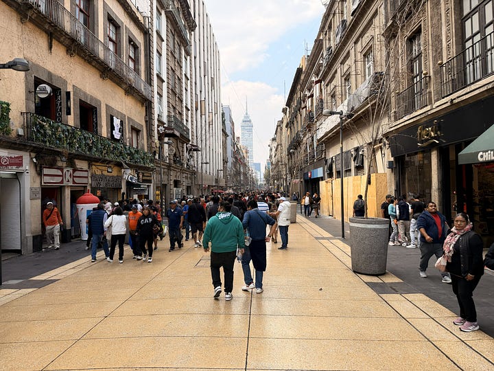 Avenida Francisco I. Madero, statue of the namesake, throngs of pedestrians, blue tiles