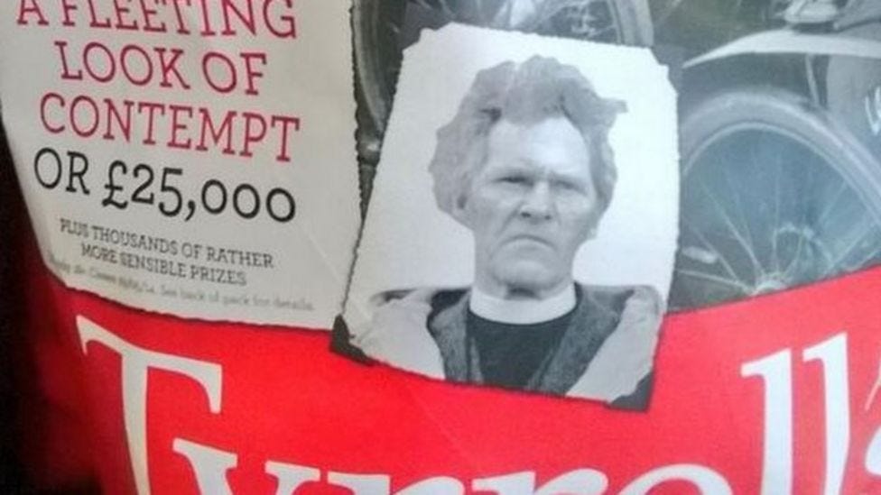 R.S. Thomas, in a dog collar, glares from a packet of crisps