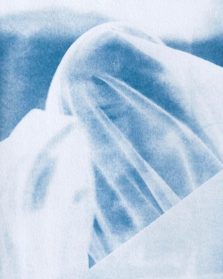 This may contain: an abstract image of a person in blue and white