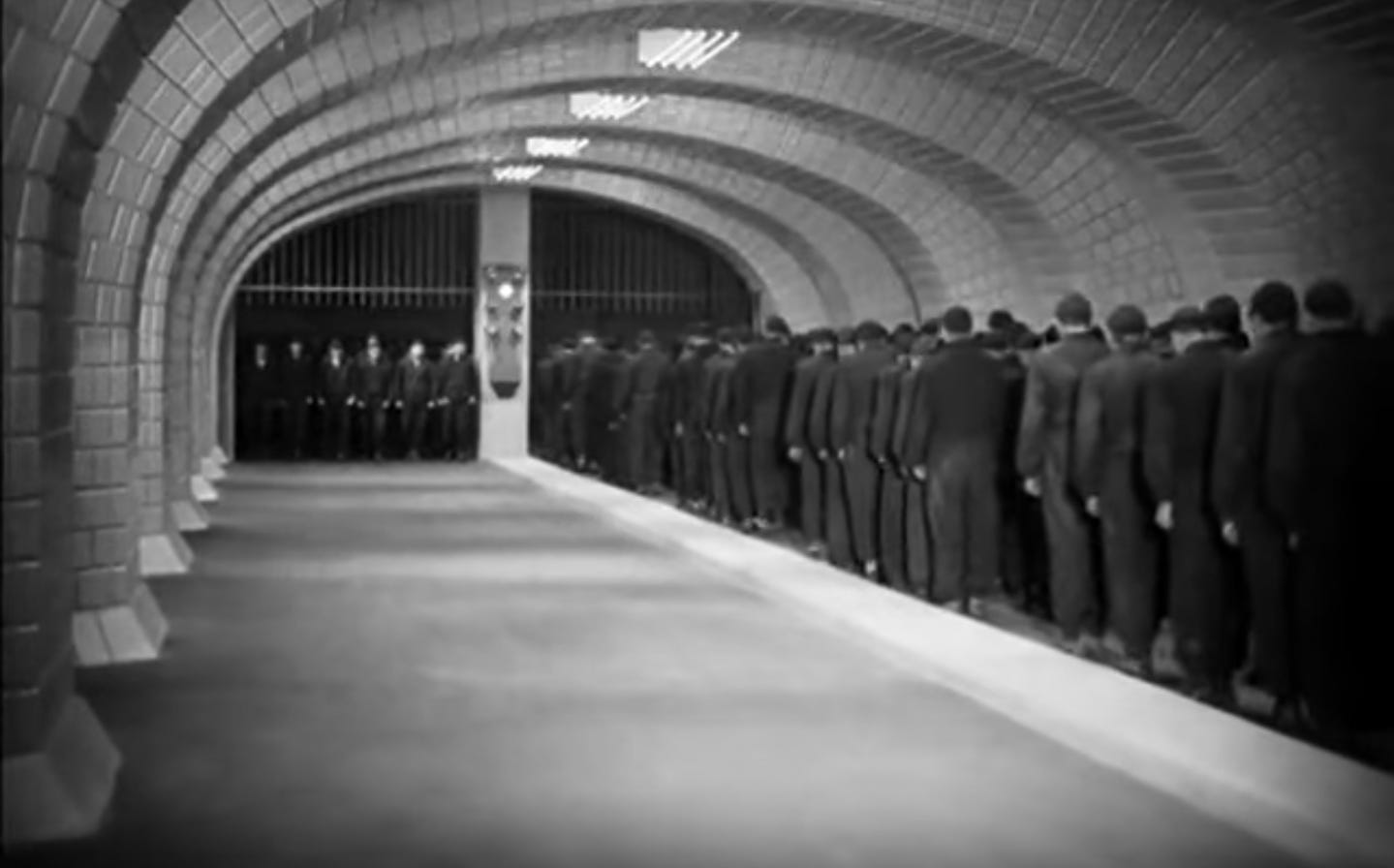 Workers trudging forward in unison