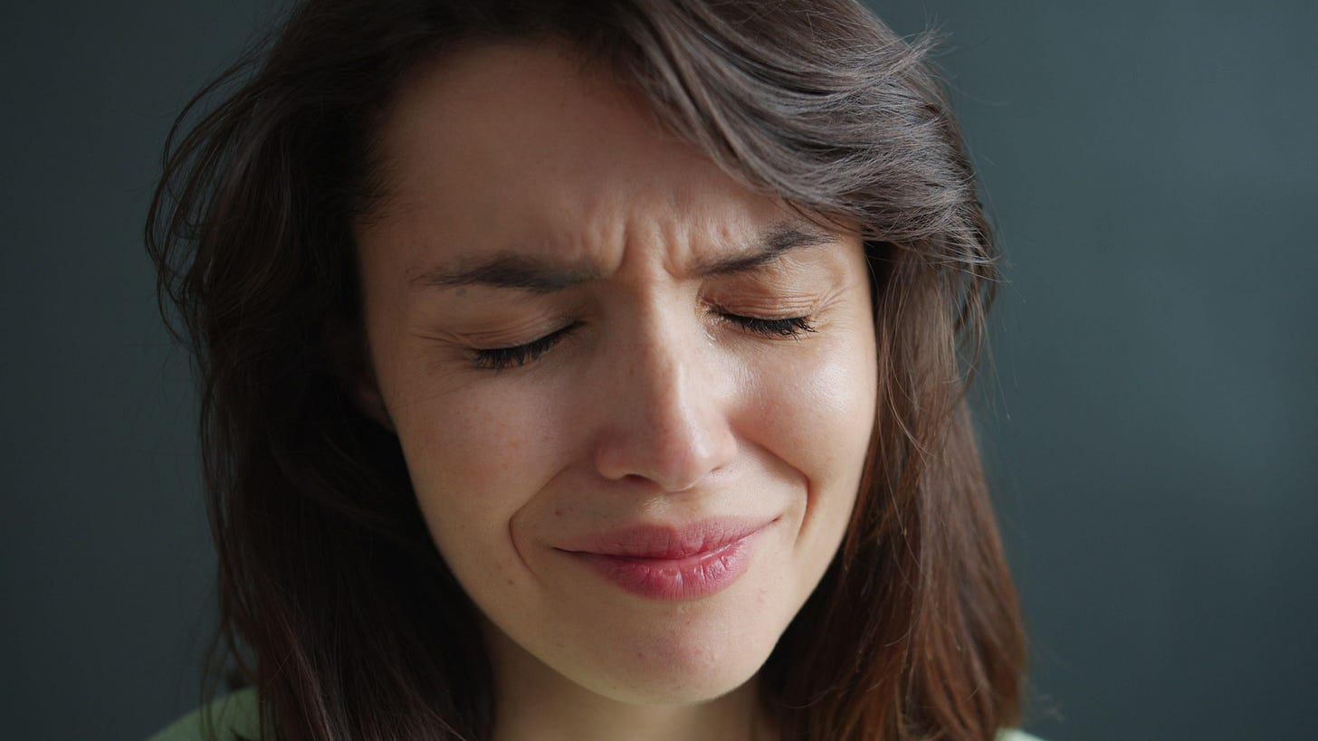 Woman grimacing
