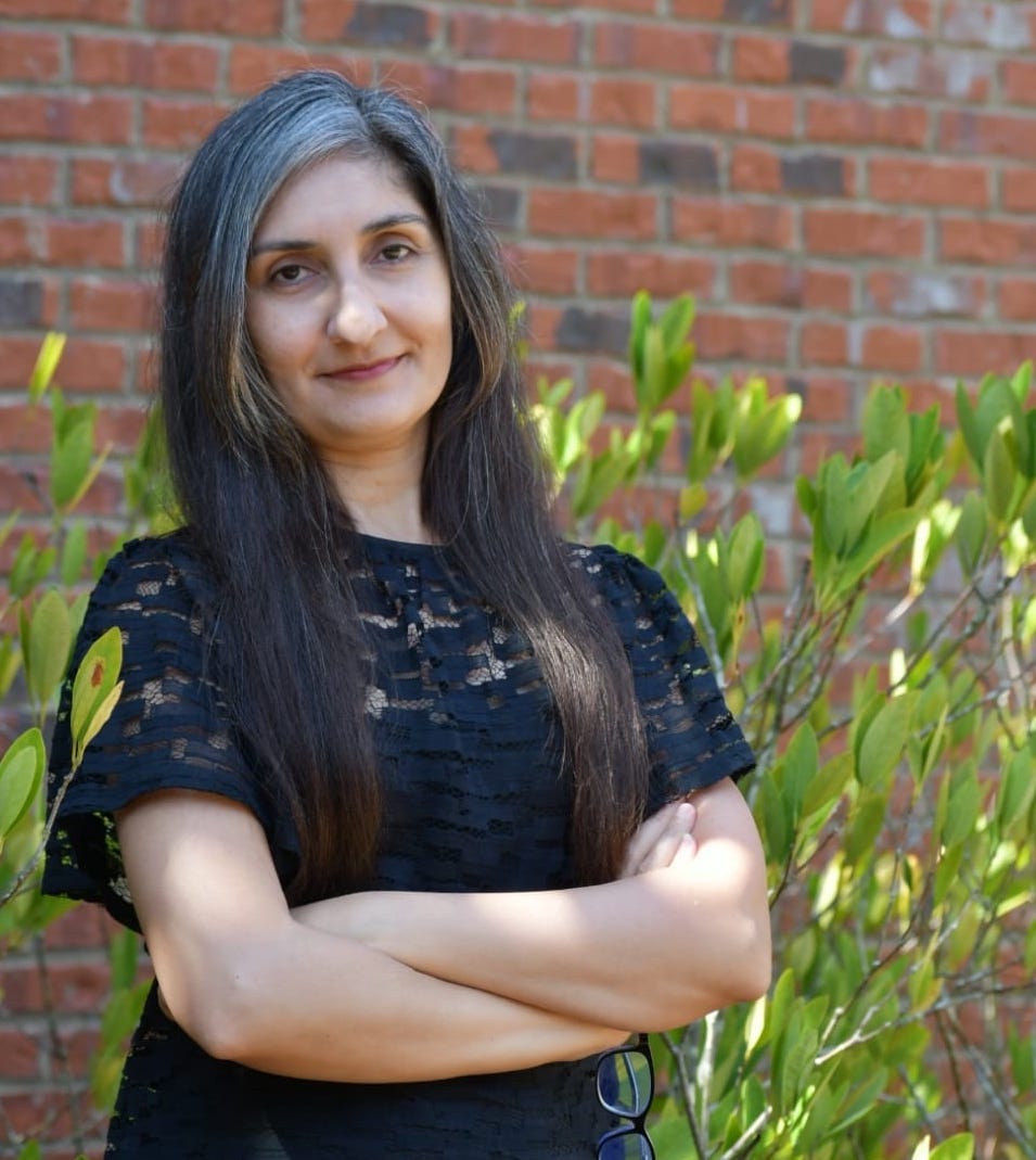 A person with her arms crossed

Description automatically generated with medium confidence